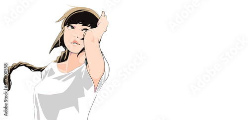 風になびく髪を抑える三つ編みの女性