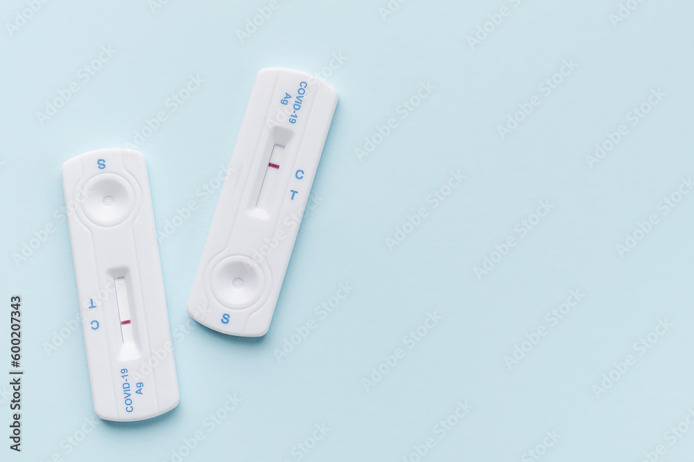 Home testing kit for coronavirus on a blue background Home testing kit for coronavirus on a blue background