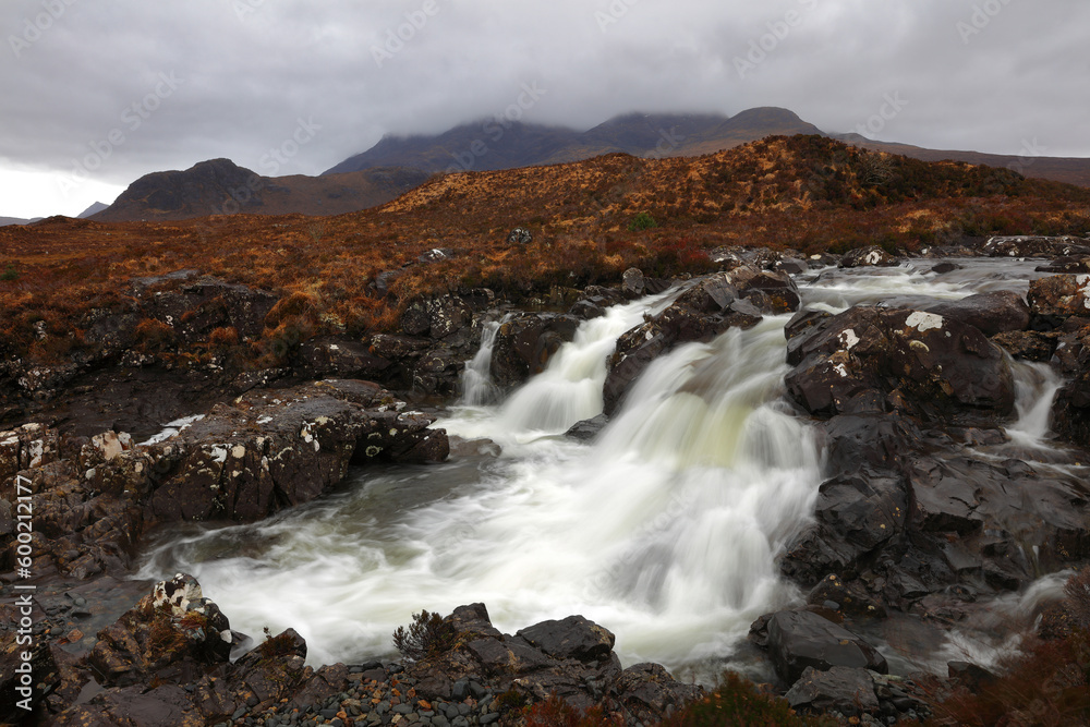 Fast flowing Waterfall at Sligachan on a cludy day. Isle of Skye, Scotland, UK. Fast flowing Waterfall at Sligachan on a cludy day. Isle of Skye, Scotland, UK.