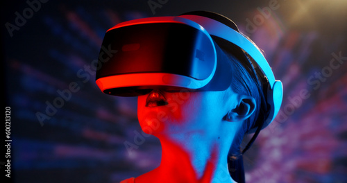 Bilde på lerret Authentic asian girl wearing bright makeup in cyberpunk light and background usi