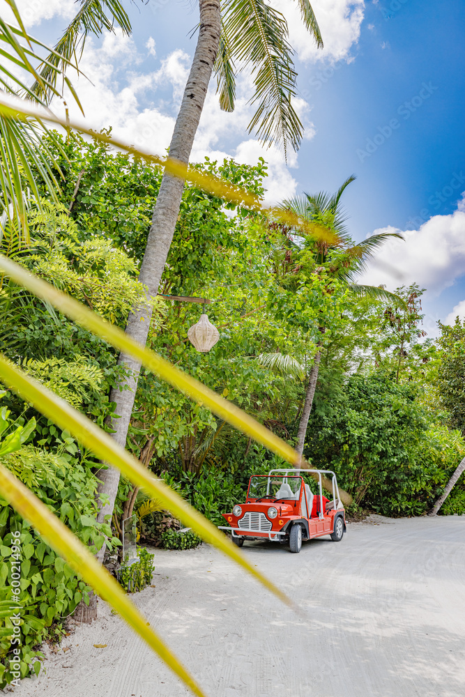 Red jeep golf cart of luxury resort. Travel service concept, ecology energy savings. Tropical island sandy road with palm trees. Red electric cart parking in the shadows. Luxurious travel vacation Red jeep golf cart of luxury resort. Travel service concept, ecology energy savings. Tropical island sandy road with palm trees. Red electric cart parking in the shadows. Luxurious travel vacation