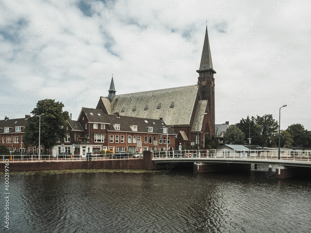 Leiden (The Netherlands).The Church of St.Joseph. View through the channel