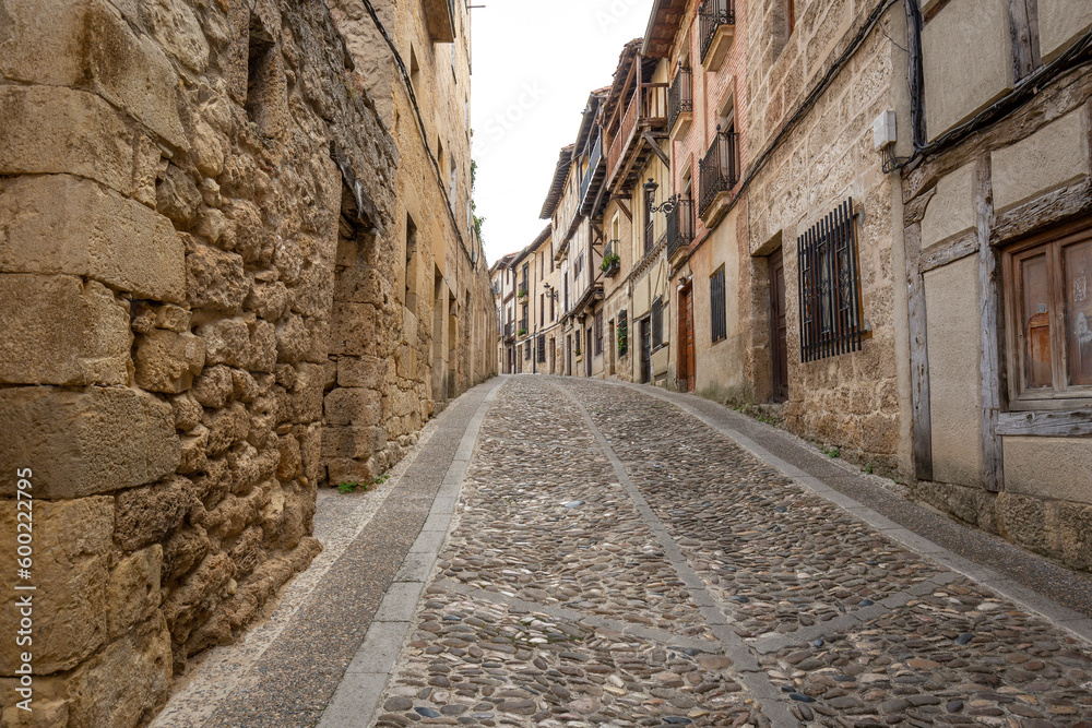 a cobbled street with traditional houses in Frías town, Las Merindades, province of Burgos, Castile and León, Spain