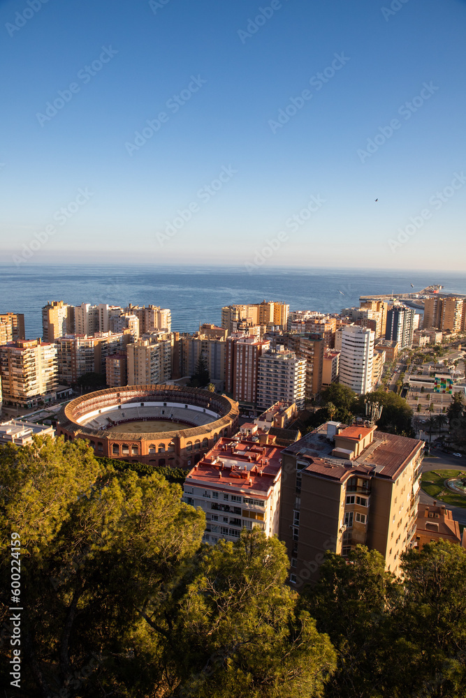 Naklejka premium view over Malaga at sunset travel banner