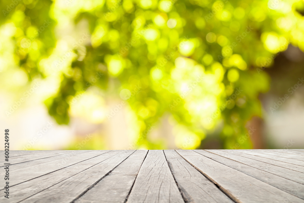 light wooden table on blurred nature bokeh background light wooden table on blurred nature bokeh background