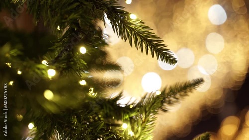 Christmas decoration. hristmas spirits and mood. New Years. Xmas tree. Warm home mood. Blurred fairy lights. photo