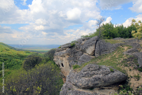 Rock monastery near the village of Royak (Bulgaria) and a view of the surrounding area 