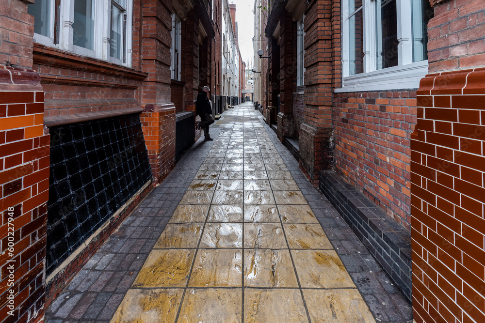self portrait in Narrow medieval alleyway in city centre self portrait in Narrow medieval alleyway in city centre