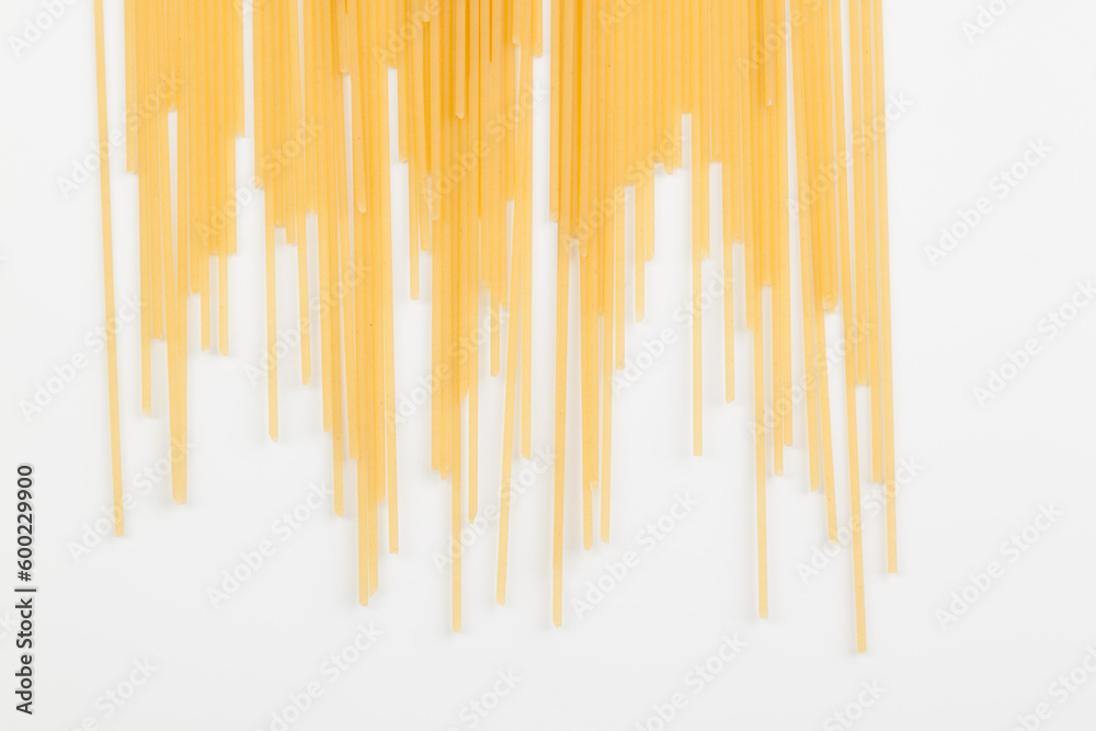 Spaghetti spread out on a white surface. Spaghetti spread out on a white surface.