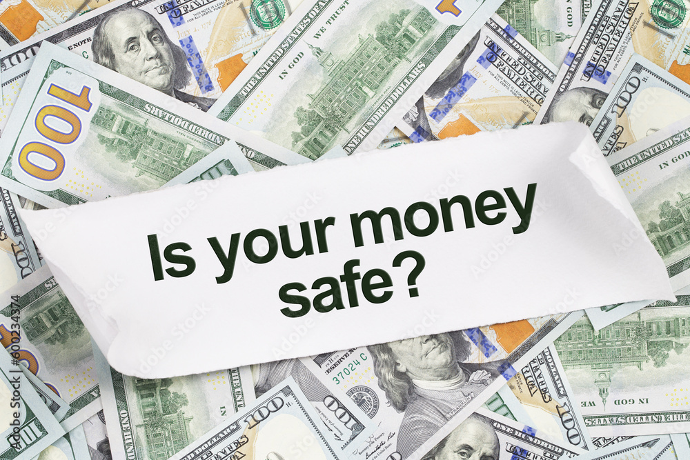 Background of US dollar bills with text. Is your money safe. banking crisis and savings concept. on a piece of paper