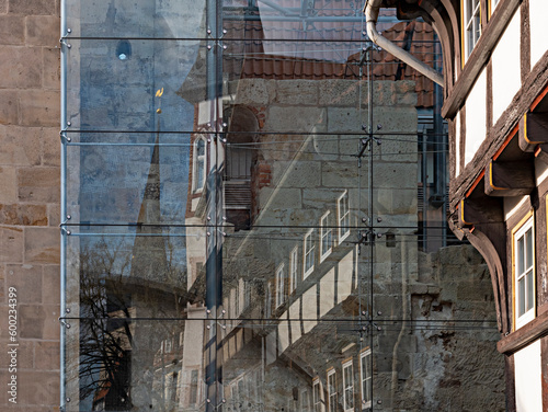 Reflection of a half-timbered house in a glass pane photo