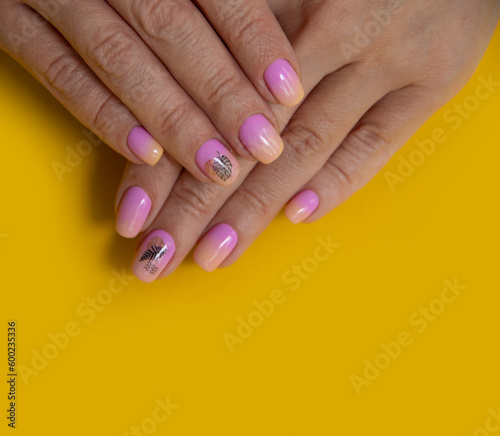 Female hand beautiful manicure on a colored background