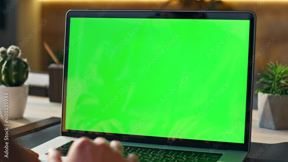 Unrecognizable person using mockup laptop working remotely at home close up.