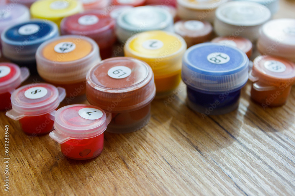 Set of cells with colored gouache. Concept of leisure, painting a picture by numbers