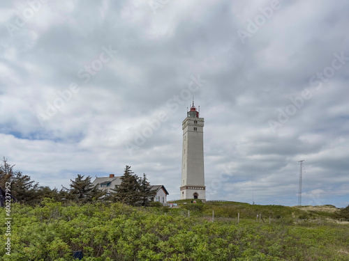 The western most point of Denmark-Bl  vand lighthouse  on Bl  vandshuk with beach view on the west coast of Jutland  Bl  vand is a town in Varde municipality in Jutland in Denmark