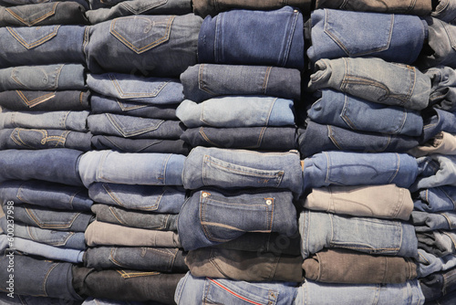 Stack of various blue jeans ,