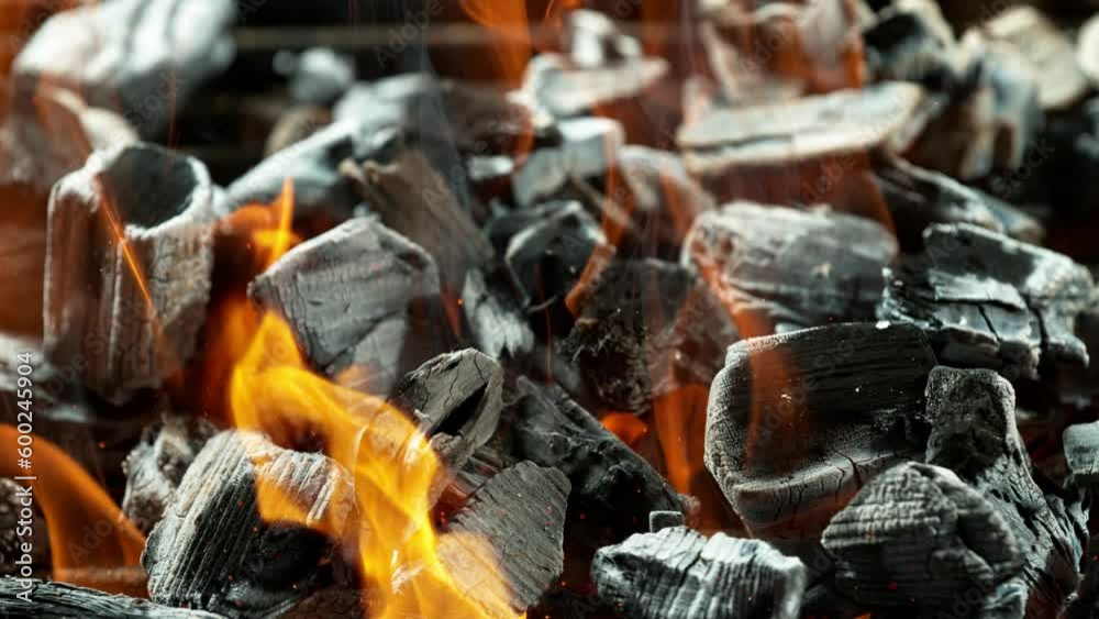Super slow motion of burning charcoal on grill grid. Filmed on high speed cinema camera, 1000 fps. Super slow motion of burning charcoal on grill grid. Filmed on high speed cinema camera, 1000 fps.