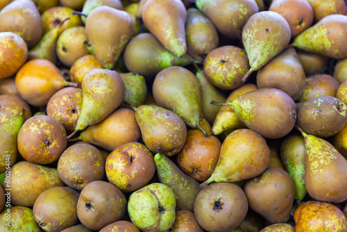 Box with organic pears displayed for sale in supermarket