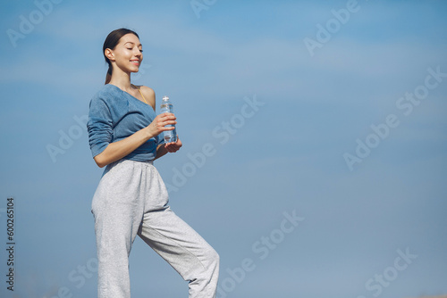 Cute girl have a rest on a sky backgroung