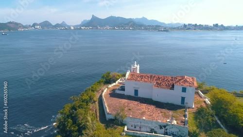 RIO DE JANEIRO, BRASIL - MAY, 2023: Drone aerial view of of a famous landmark Boa Viagem fortress and Guanabara Bay. Historical buildings on the shore on background at sunny day from above.