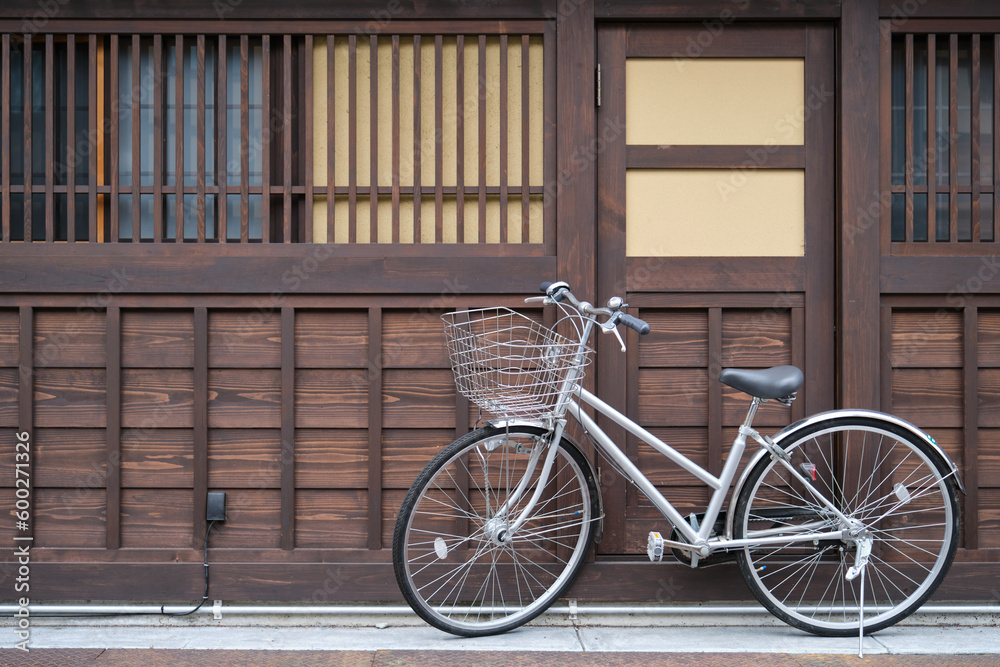 Bicycle park outside a Japanese wooden house in Takayama, Hida, Gifu, Japan. Bicycle park outside a Japanese wooden house in Takayama, Hida, Gifu, Japan.