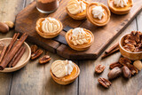 Mini pumpkin pies with pumpkin and fall leaves decoration