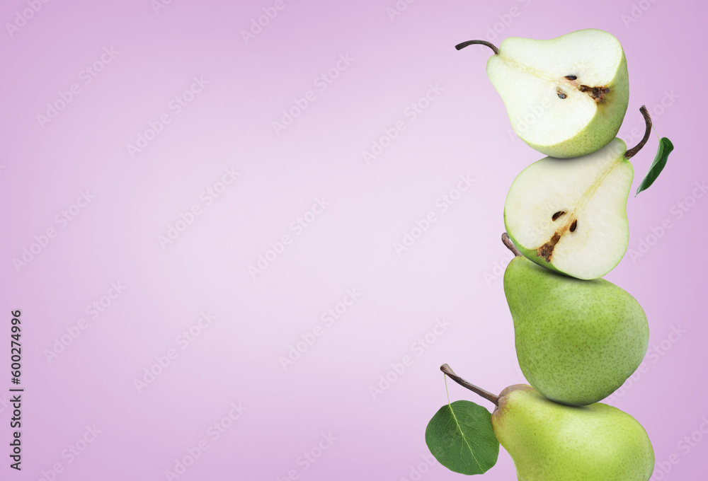 Fresh ripe pears on pale violet background, space for text