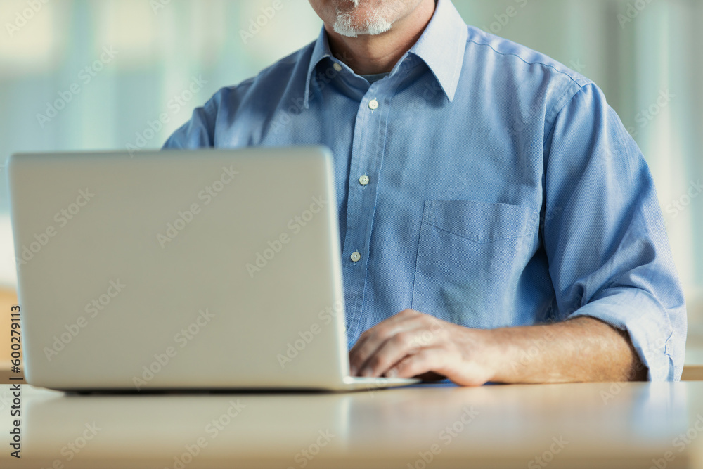 Generic concept of WFH with laptop for mature men Generic concept of WFH with laptop for mature men