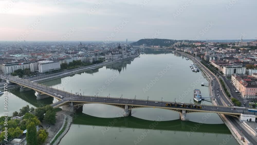 Establishing Aerial View Shot of Budapest, Hungary at sunrise. Margaret Bridge or Margit hid over River Danube, embankment. Public transport in the city