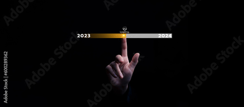 Fototapeta Naklejka Na Ścianę i Meble -  Business start up new goals touching virtual number future growth from 2023 to 2024, plan and vision for next year, progress and success in 2024, challenge and business technology concept.