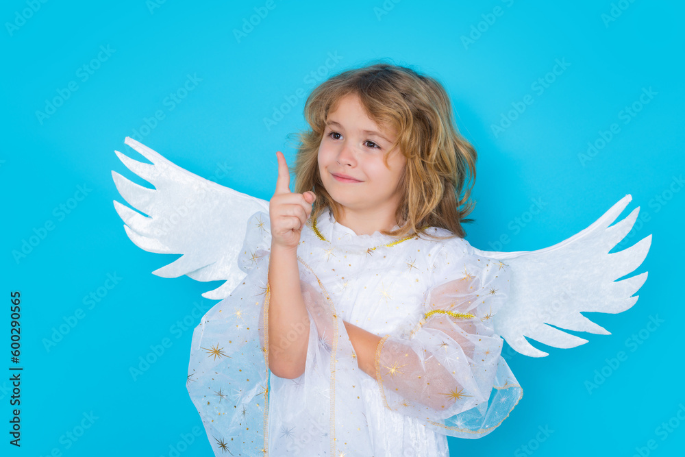 Valentines day banner. Cute child with angel wings. Studio portrait of angel child on studio color isolated background with copy space. Valentines day banner. Cute child with angel wings. Studio portrait of angel child on studio color isolated background with copy space.