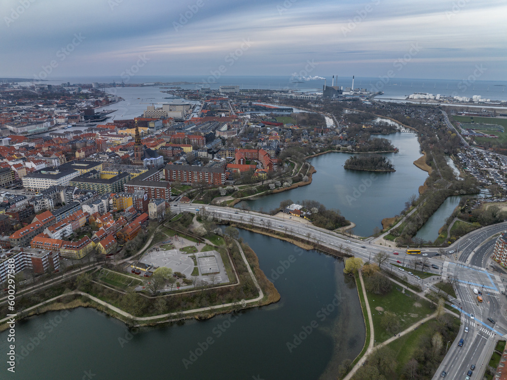Aerial view of polygonal bastions and water filled moat protecting Copenhagen Christiania neighborhood during sunset