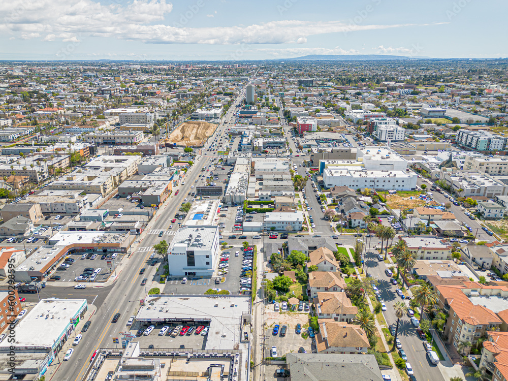Los Angeles, California – May 3, 2023: aerial city view drone photo toward Olympic Blvd and Vermont Ave in Koreatown LA showing Korean shops, apartments, homes, streets, buildings
