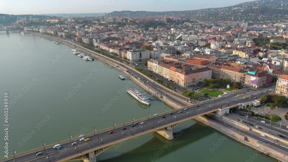 Aerial view of Budapest Margaret Bridge or Margit hid over River Danube, embankment. Public transport in the city. Yellow tram passing through the bridge. Hungary. Aerial view of Budapest Margaret Bridge or Margit hid over River Danube, embankment. Public transport in the city. Yellow tram passing through the bridge. Hungary.
