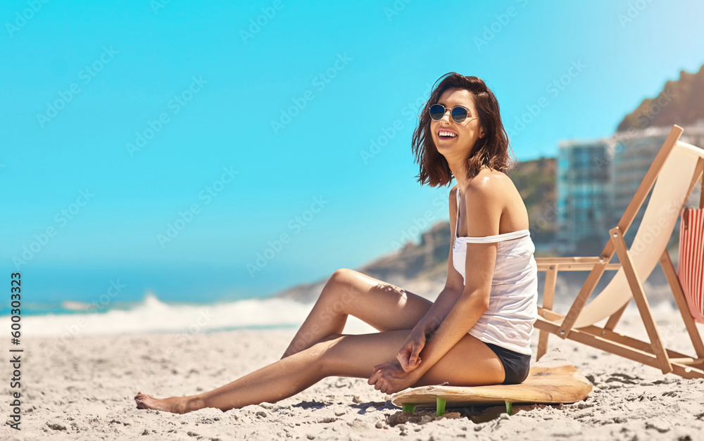 Woman, sand and sitting on surfboard with smile, beach or sunglasses in summer nature for vacation mockup space. Young surfer girl, relax outdoor and happy with excited face for holiday by ocean Woman, sand and sitting on surfboard with smile, beach or sunglasses in summer nature for vacation mockup space. Young surfer girl, relax outdoor and happy with excited face for holiday by ocean