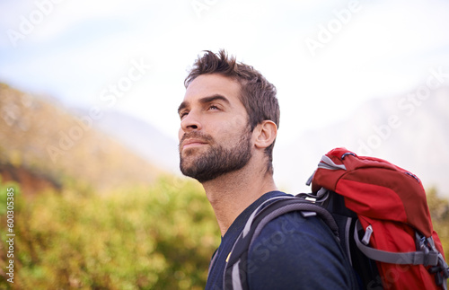Hiking, relax and thinking with man on mountain for fitness, adventure and travel journey. Backpack, summer and workout with male hiker trekking in nature path for training, freedom and explore