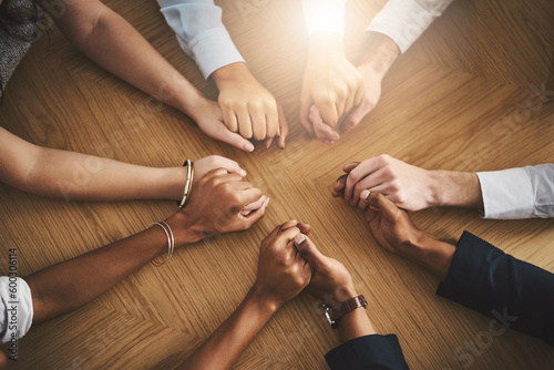 Quadro su tela Support, diversity and people holding hands by a table at a group counseling or therapy session