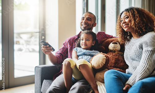 Photography Love, smile and family on a couch, watching tv and bonding on a weekend break, home or chilling