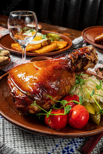Photography Tasty grilled ham hock on a plate with  cabbage salad
