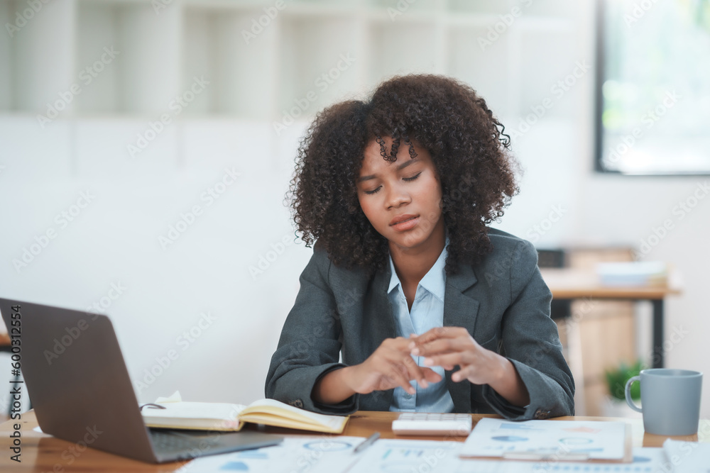 Businesswoman having finger pain from using laptop computer, finger pain. Businesswoman having finger pain from using laptop computer, finger pain.