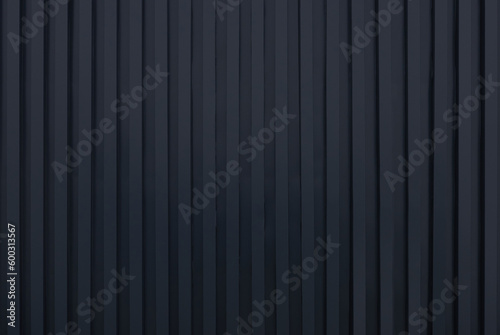 Fotografia black metal siding fence striped background