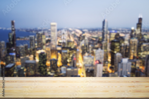 Empty tabletop made of wooden dies with blurry city view at dusk on background  template