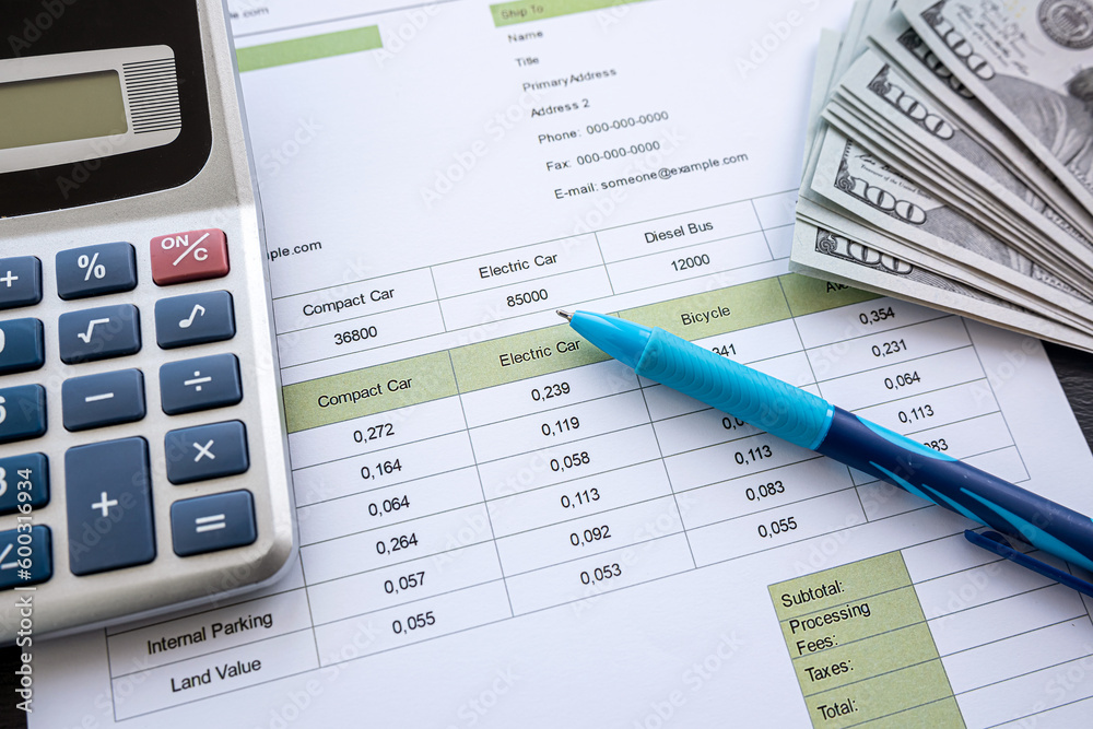 Accounting charts and graphs with us dollar bills pen calculator Accounting charts and graphs with us dollar bills pen calculator