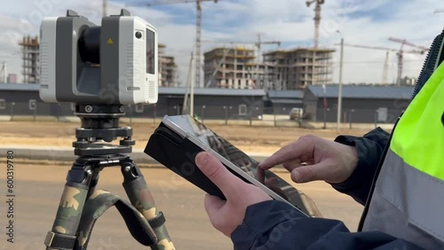 Engineer surveyor at the construction site
