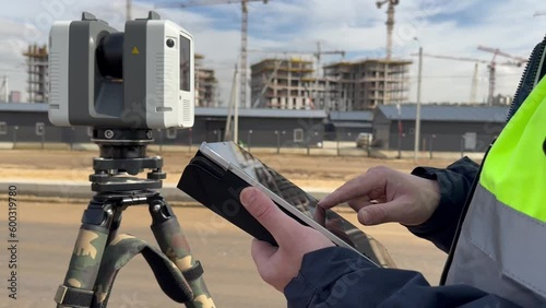 Engineer surveyor at the construction site photo