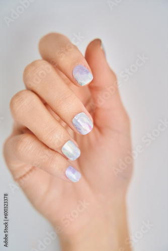 Close-up of female hands with colourful nails. Manicure and beauty concept.
