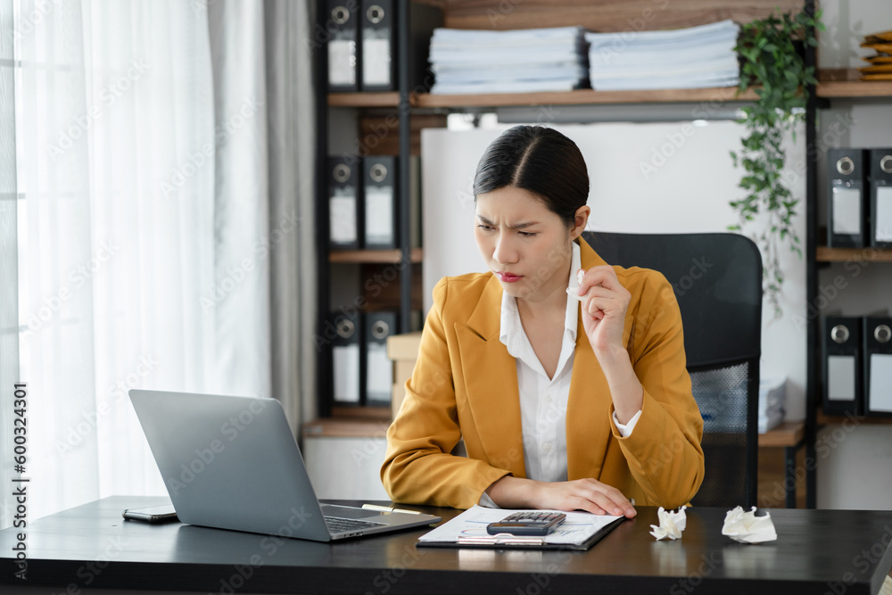 Serious businesswoman concentrating on his paper work at the table at office. Serious businesswoman concentrating on his paper work at the table at office.