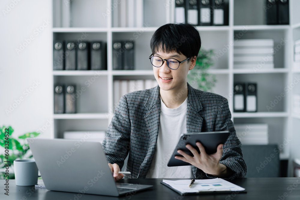Business documents on office table with laptop and digital tablet and graph financial. Business documents on office table with laptop and digital tablet and graph financial.