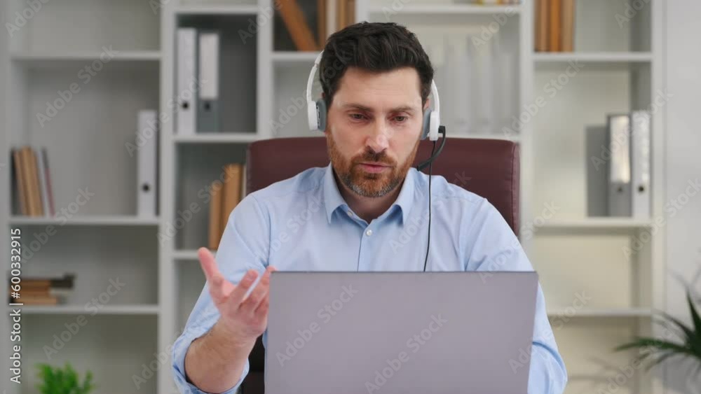 Online conversation. By the table with laptop. Doctor in formal clothes is working in the cabinet. Online conversation. By the table with laptop. Doctor in formal clothes is working in the cabinet.