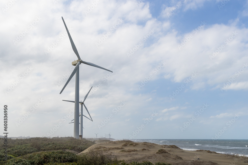 Wind turbine field over the sea in the evening Wind turbine field over the sea in the evening